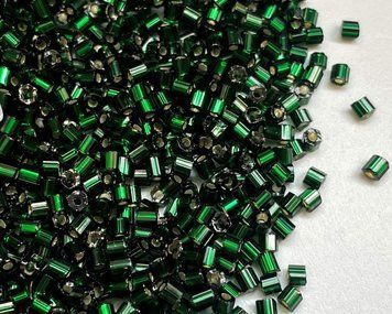 Green dark transparent with silvered center, Czech cut