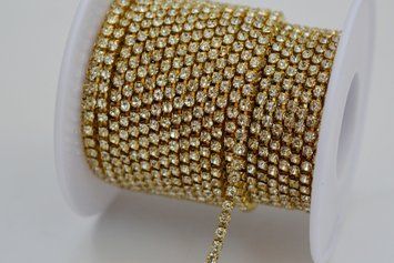 Crystal rhinestone chain in light gold with a distance of 0,5 mm (2,3 mm)