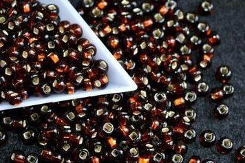 Dark gold with a square silver-plated center large, Czech beads